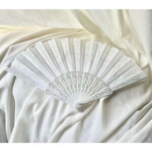 White hand fan with sparkle detailing ￼